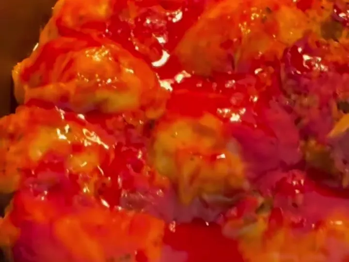 Stuffed cabbage rolls baked in red tomato sauce in a pot